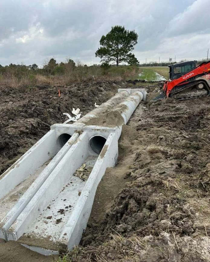 Concrete box culverts installed with a Kubota track loader
