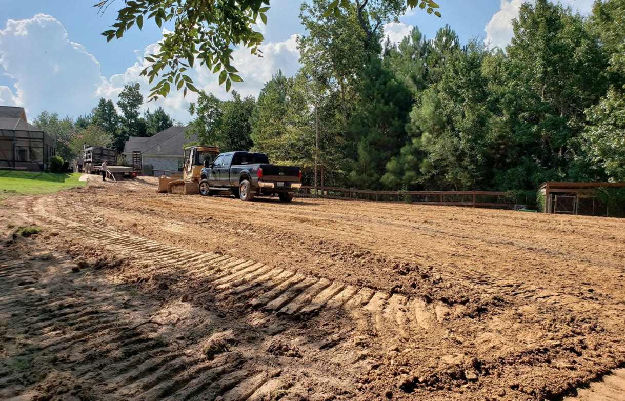 Komatsu excavator and dozer grading a commercial site